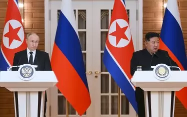 Ким Чен-ун и Путин застават рамо до рамо на военния парад в Пекин